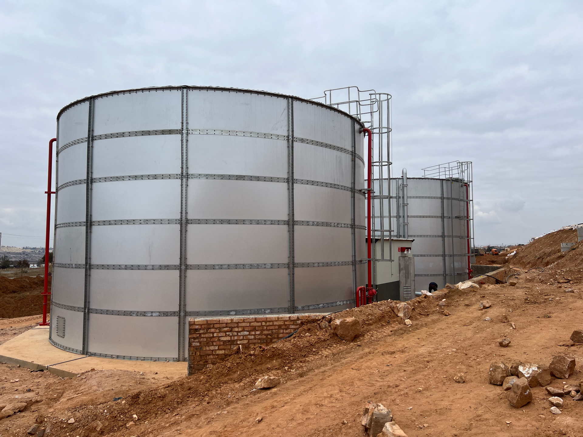 Side view of Leratong City Mall's cylindrical steel fire water storage tanks