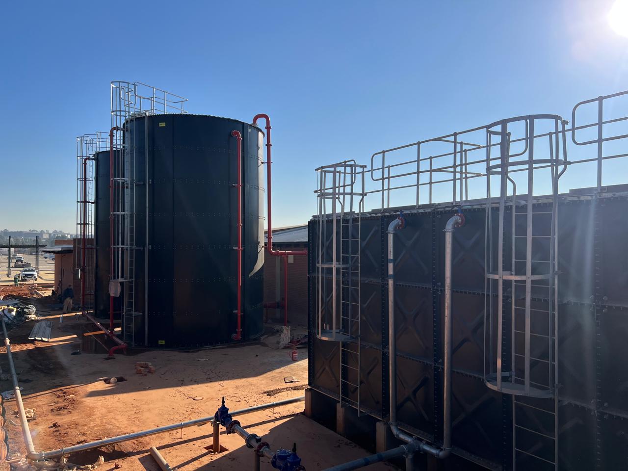 Rear view of Videx cylindrical and sectional water tanks at Fleurhof Mall