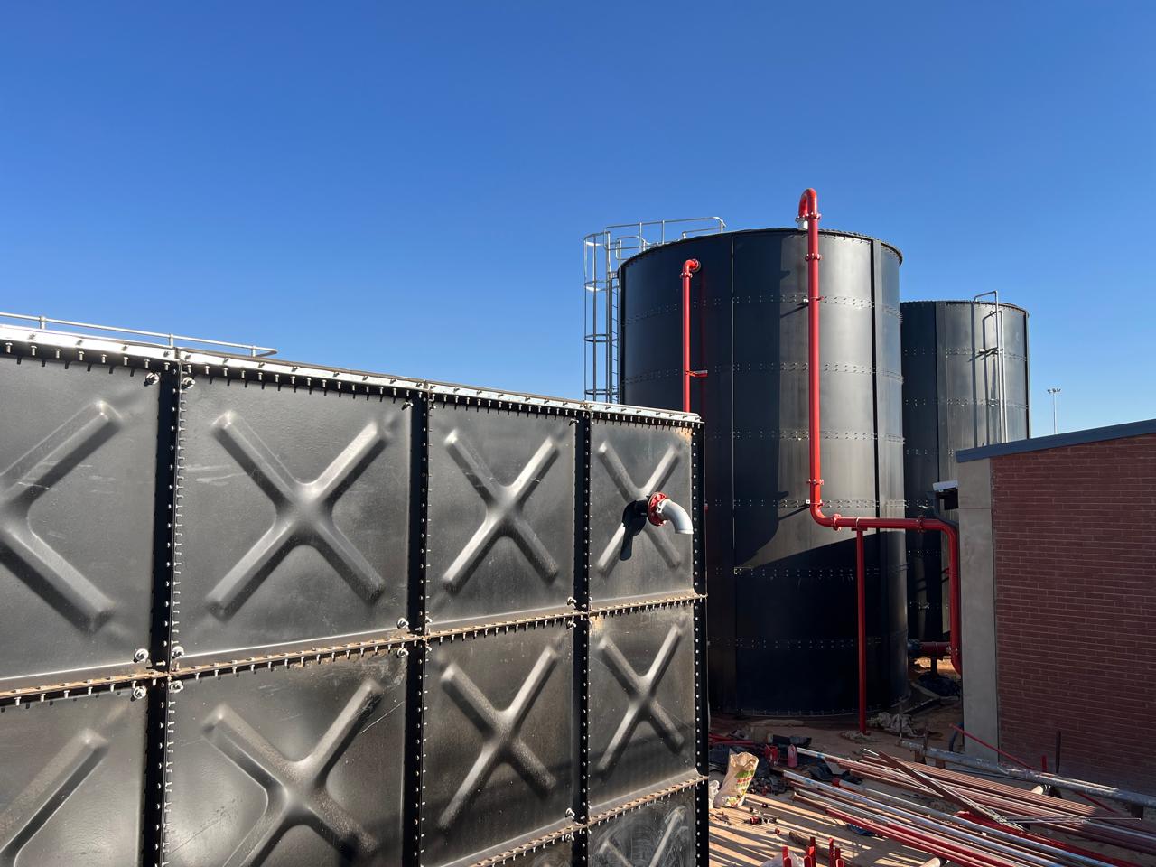 Fleurhof Mall industrial water storage — sectional and cylindrical tanks together
